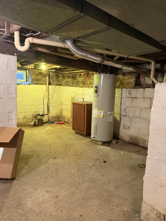 404 Prairie St, Mauston, WI 53948 - unfinished basement featuring electric water heater