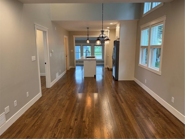 1028 Chauncey St, Eau Claire, WI 54701 - unfurnished dining area with dark wood-style floors and a chandelier