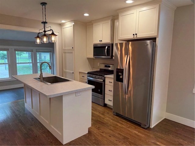 1028 Chauncey St, Eau Claire, WI 54701 - kitchen with appliances with stainless steel finishes, dark wood-style flooring, white cabinetry, a kitchen island with sink, and recessed lighting