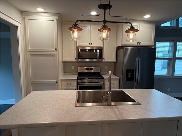 1028 Chauncey St, Eau Claire, WI 54701 - kitchen featuring appliances with stainless steel finishes, white cabinetry, plenty of natural light, light countertops, and recessed lighting