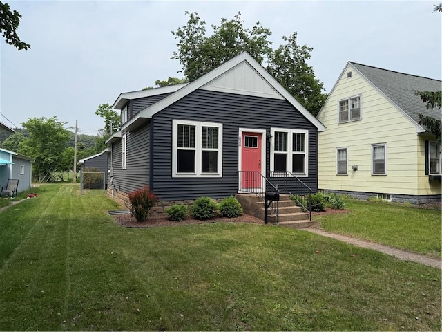 1028 Chauncey St, Eau Claire, WI 54701 - view of front facade featuring a front yard and board and batten siding