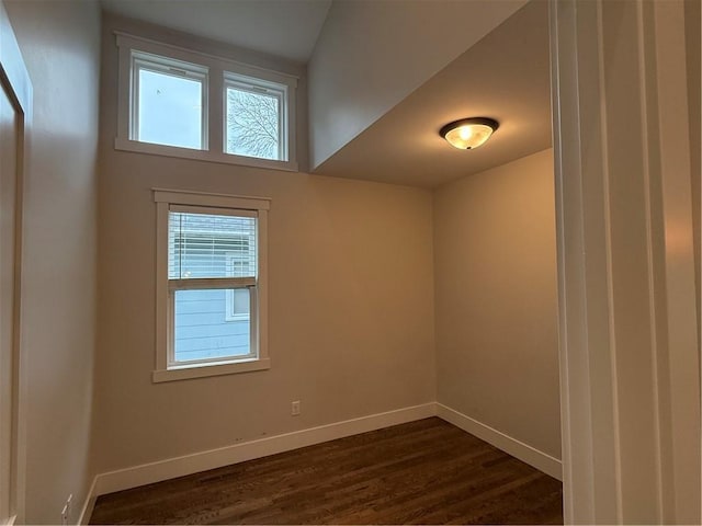 1028 Chauncey St, Eau Claire, WI 54701 - unfurnished room with healthy amount of natural light and dark wood finished floors