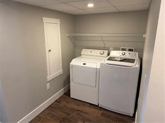 1028 Chauncey St, Eau Claire, WI 54701 - washroom featuring washer and clothes dryer and dark wood-style flooring