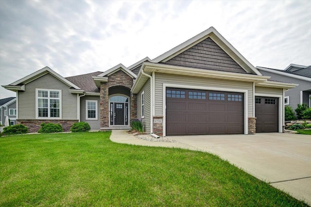 6586 Wolf Hollow Rd, Windsor, WI 53598 - craftsman house with stone siding, a garage, driveway, and a front lawn