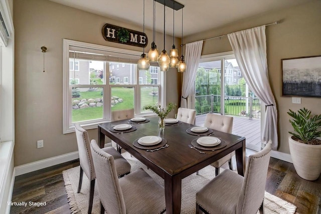 6586 Wolf Hollow Rd, Windsor, WI 53598 - dining area featuring dark wood finished floors and a chandelier