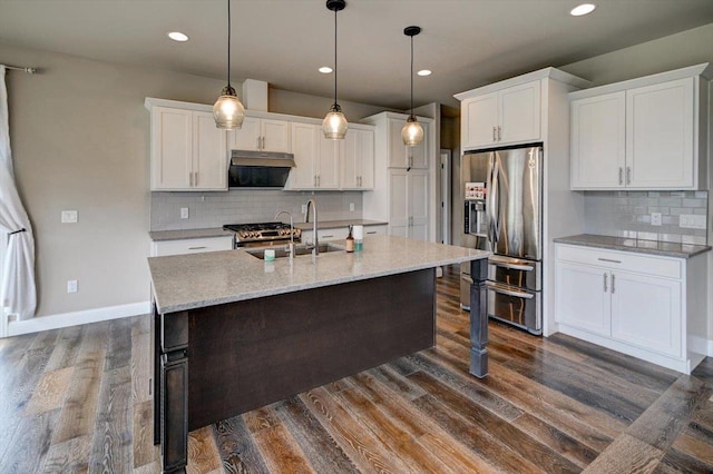 6586 Wolf Hollow Rd, Windsor, WI 53598 - kitchen featuring stainless steel appliances, range hood, white cabinets, decorative backsplash, and recessed lighting
