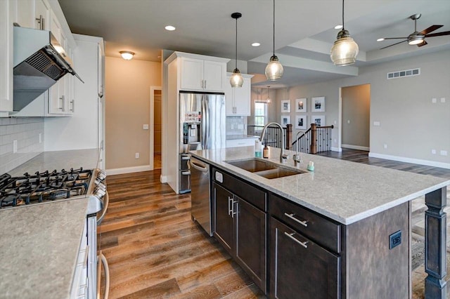6586 Wolf Hollow Rd, Windsor, WI 53598 - kitchen with appliances with stainless steel finishes, wood finished floors, a ceiling fan, tasteful backsplash, and recessed lighting