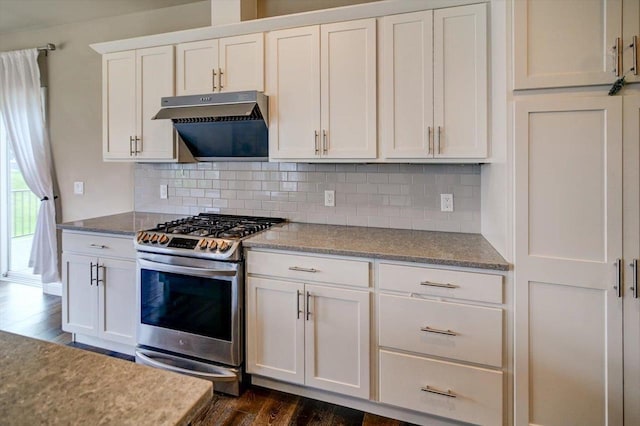 6586 Wolf Hollow Rd, Windsor, WI 53598 - kitchen with stainless steel range with gas stovetop, under cabinet range hood, dark wood-style floors, white cabinets, and backsplash