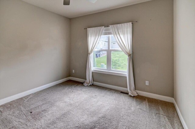 6586 Wolf Hollow Rd, Windsor, WI 53598 - unfurnished room featuring carpet and a ceiling fan