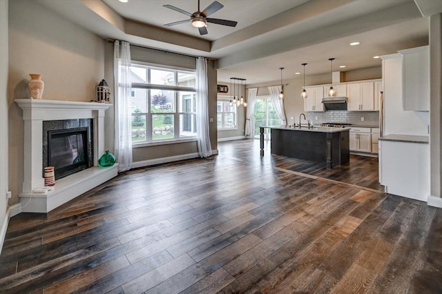 6586 Wolf Hollow Rd, Windsor, WI 53598 - kitchen with ceiling fan, dark wood-type flooring, white cabinetry, a breakfast bar area, and recessed lighting