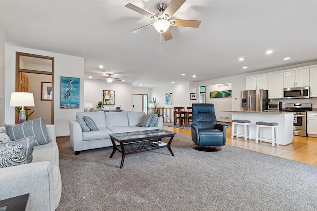 705 E Mason Dr, Edgerton, WI 53534 - living area featuring a ceiling fan, recessed lighting, and light colored carpet