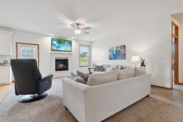 705 E Mason Dr, Edgerton, WI 53534 - living room featuring light colored carpet, plenty of natural light, ceiling fan, and recessed lighting