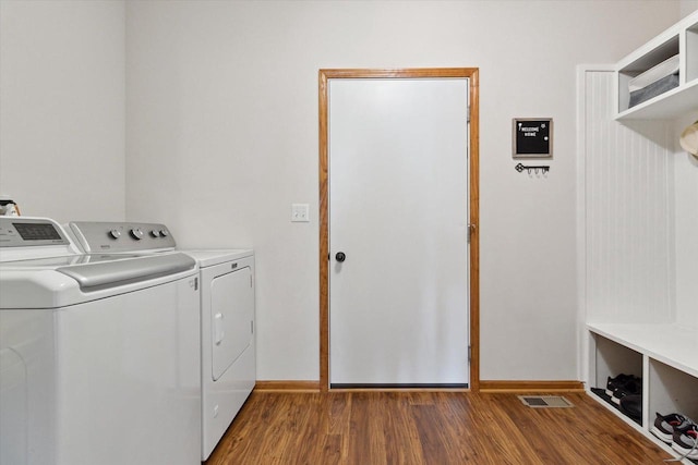 705 E Mason Dr, Edgerton, WI 53534 - laundry room featuring separate washer and dryer and wood finished floors