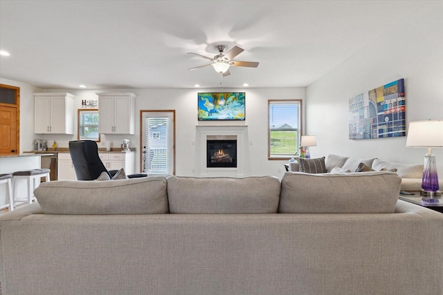 705 E Mason Dr, Edgerton, WI 53534 - living room with ceiling fan, recessed lighting, and a glass covered fireplace