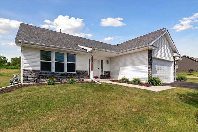 705 E Mason Dr, Edgerton, WI 53534 - ranch-style home featuring a garage, driveway, a shingled roof, and stone siding