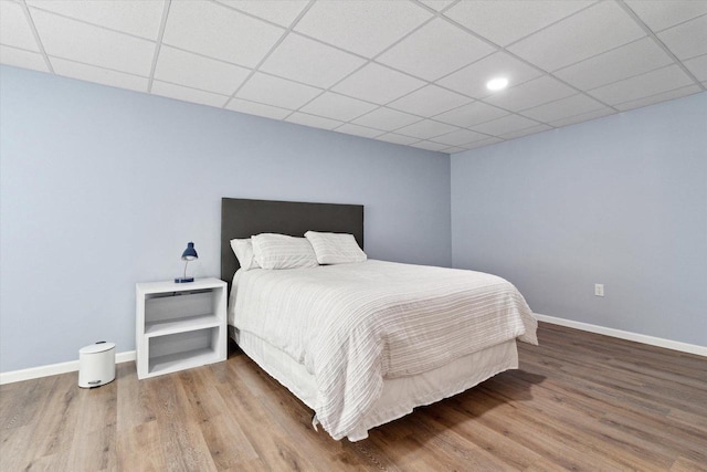 705 E Mason Dr, Edgerton, WI 53534 - bedroom featuring wood finished floors, a drop ceiling, and recessed lighting