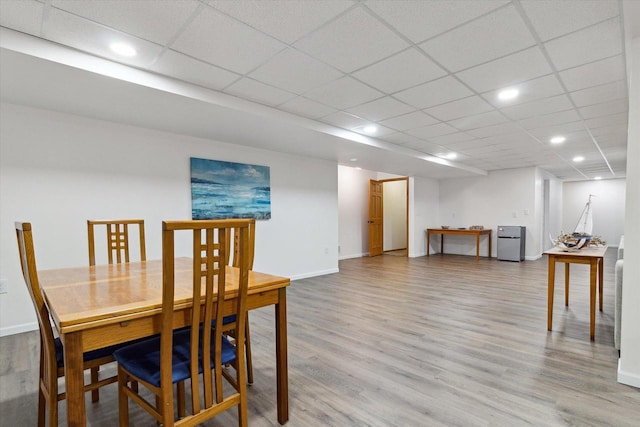 705 E Mason Dr, Edgerton, WI 53534 - dining room with wood finished floors, recessed lighting, and a drop ceiling