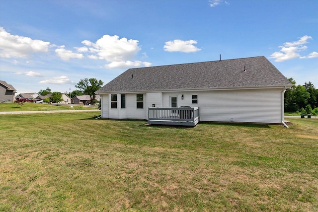 705 E Mason Dr, Edgerton, WI 53534 - back of house with a wooden deck and a lawn
