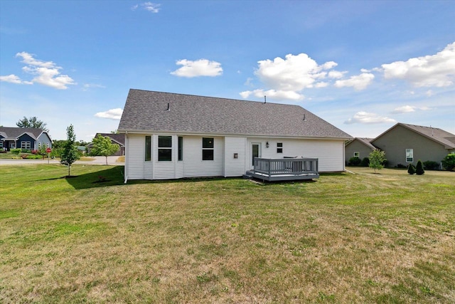 705 E Mason Dr, Edgerton, WI 53534 - back of property with a wooden deck and a lawn
