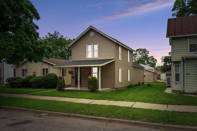 1413 Avon St, La Crosse, WI 54603 - traditional-style house with a porch, a front lawn, and roof with shingles