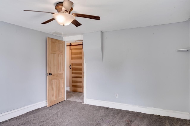 1413 Avon St, La Crosse, WI 54603 - unfurnished room with carpet flooring, ceiling fan, and a barn door