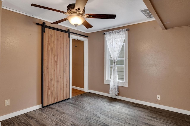1413 Avon St, La Crosse, WI 54603 - unfurnished bedroom featuring wood finished floors, a barn door, and ceiling fan