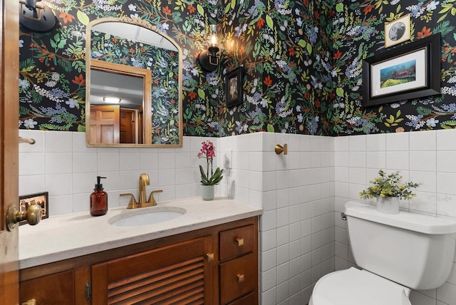 5026 Coney Weston Pl, Madison, WI 53711 - half bathroom featuring wallpapered walls, vanity, tile walls, and wainscoting