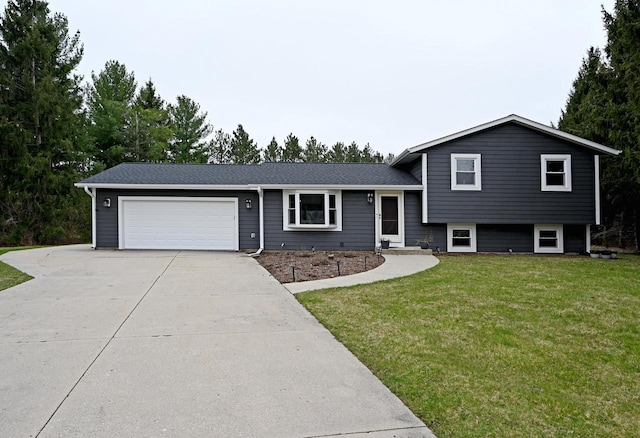 W355N5843 Bridle Ln, Oconomowoc, WI 53066 - split level home featuring concrete driveway, an attached garage, and a front yard