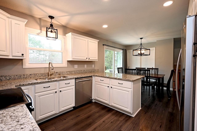 W355N5843 Bridle Ln, Oconomowoc, WI 53066 - kitchen featuring stainless steel appliances, a peninsula, recessed lighting, white cabinets, and dark wood-style flooring