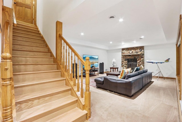 W332S9291 Red Brae Dr, Mukwonago, WI 53149 - carpeted living area with stairs, recessed lighting, and a fireplace