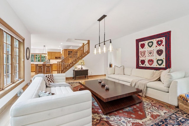 W332S9291 Red Brae Dr, Mukwonago, WI 53149 - living room with light wood-style flooring, stairs, recessed lighting, and a chandelier