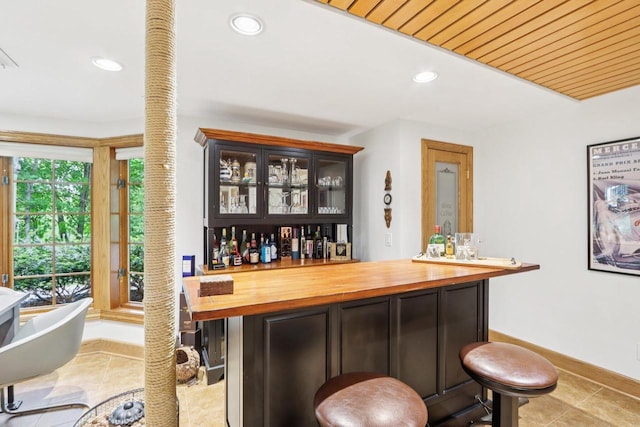 W332S9291 Red Brae Dr, Mukwonago, WI 53149 - indoor dry bar featuring tile patterned flooring, recessed lighting, and decorative columns