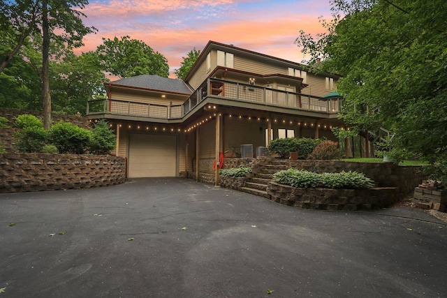 W332S9291 Red Brae Dr, Mukwonago, WI 53149 - view of front of home featuring asphalt driveway, a balcony, and a garage