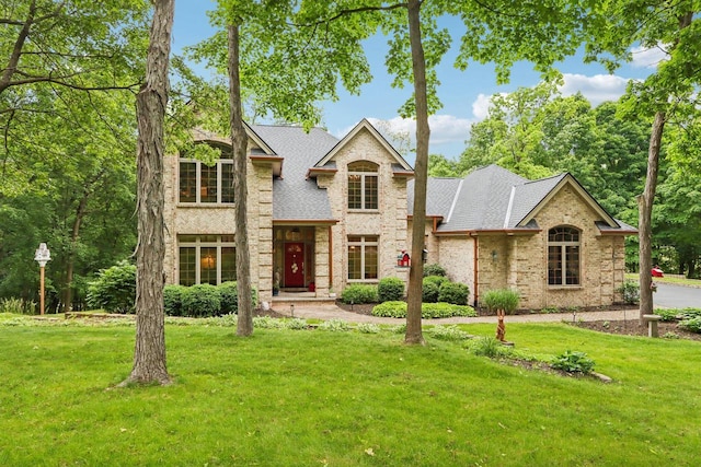 W332S9291 Red Brae Dr, Mukwonago, WI 53149 - traditional-style house featuring a front lawn, brick siding, and roof with shingles