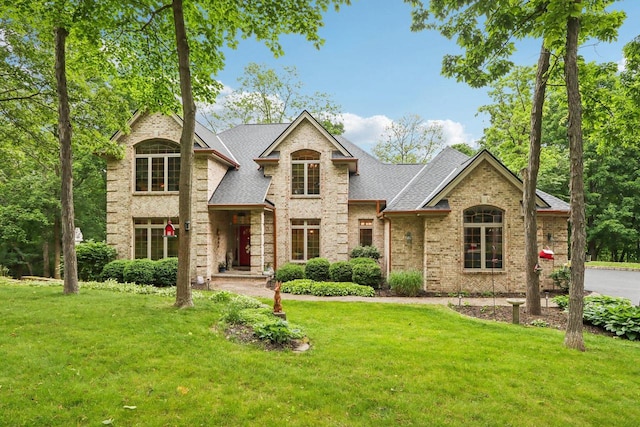 W332S9291 Red Brae Dr, Mukwonago, WI 53149 - traditional-style home featuring a front yard, brick siding, and roof with shingles