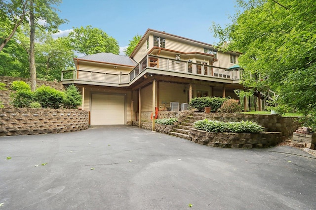 W332S9291 Red Brae Dr, Mukwonago, WI 53149 - view of front of property featuring driveway, a garage, and a balcony
