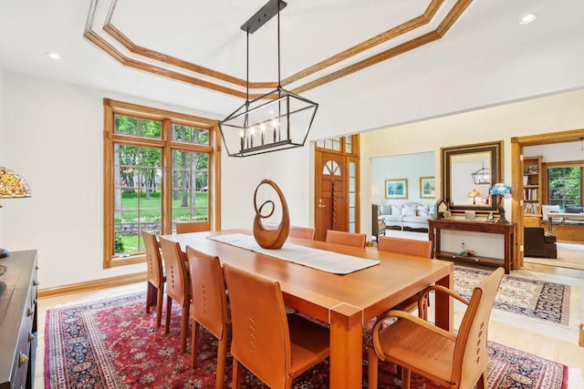 W332S9291 Red Brae Dr, Mukwonago, WI 53149 - dining area featuring a tray ceiling, ornamental molding, a chandelier, wood finished floors, and recessed lighting