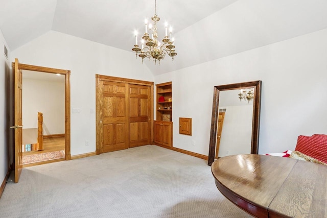 W332S9291 Red Brae Dr, Mukwonago, WI 53149 - dining area featuring lofted ceiling, a chandelier, and light colored carpet