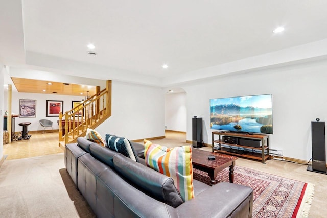 W332S9291 Red Brae Dr, Mukwonago, WI 53149 - living area featuring light carpet, stairs, arched walkways, recessed lighting, and a raised ceiling
