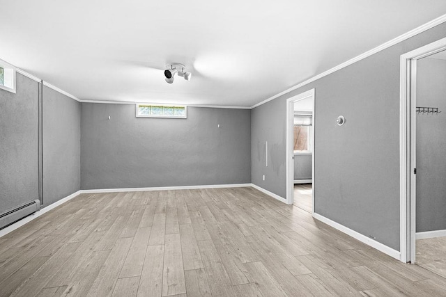 6D Hayes Ct, Superior, WI 54880 - unfurnished room with wood finished floors, ornamental molding, and a baseboard radiator