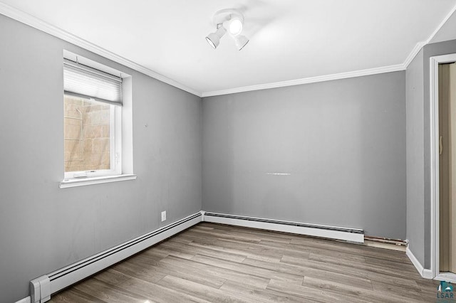 6D Hayes Ct, Superior, WI 54880 - empty room with ornamental molding, a baseboard heating unit, and wood finished floors