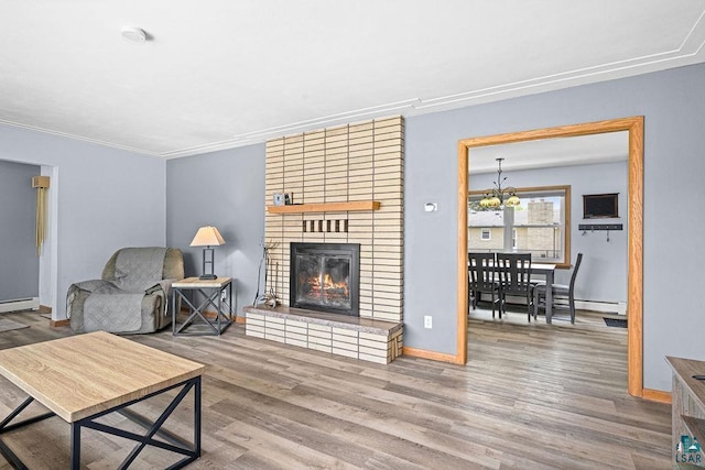 6D Hayes Ct, Superior, WI 54880 - living area with wood finished floors, a chandelier, a fireplace, and crown molding