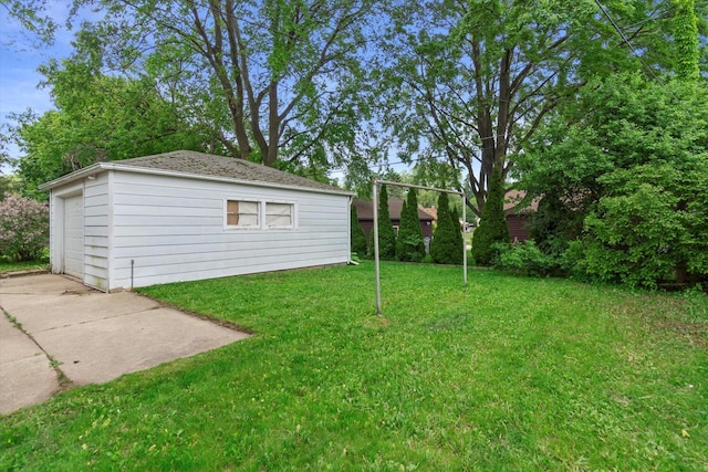 3669 S Quincy Ct, Milwaukee, WI 53207 - view of grassy yard with an outdoor structure and a garage