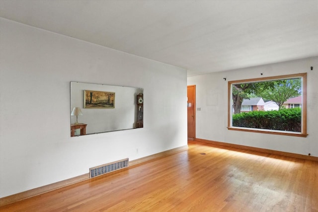 3669 S Quincy Ct, Milwaukee, WI 53207 - empty room featuring wood finished floors and baseboards
