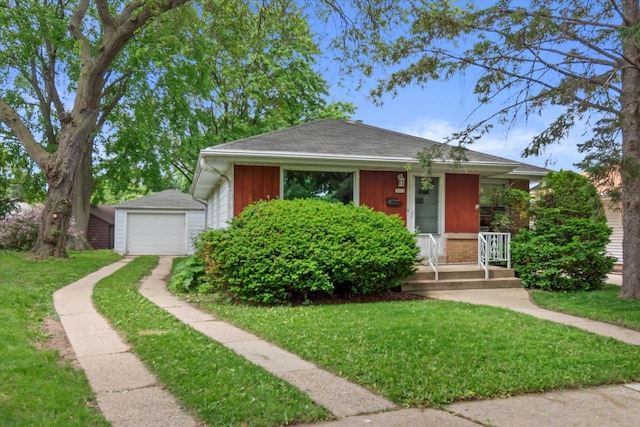 3669 S Quincy Ct, Milwaukee, WI 53207 - bungalow with a detached garage, driveway, a front yard, an outdoor structure, and a porch