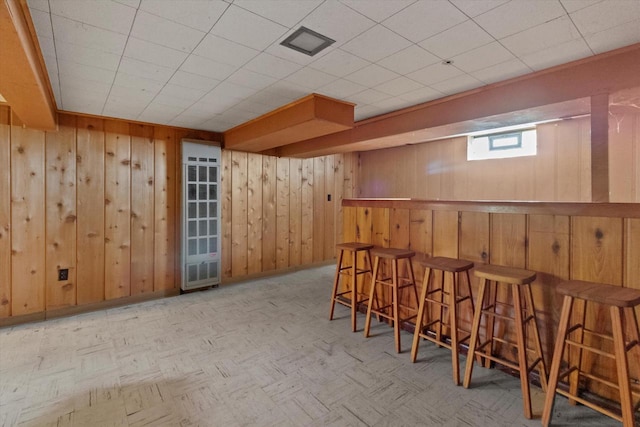 3669 S Quincy Ct, Milwaukee, WI 53207 - indoor dry bar featuring wooden walls and baseboards