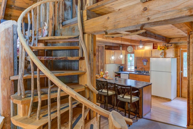 W3562 Glencoe Ave, Montello, WI 53949 - staircase with wooden walls, wood finished floors, and a wooden ceiling with exposed beams