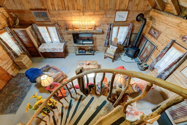 W3562 Glencoe Ave, Montello, WI 53949 - living area with a wood stove, wooden walls, and wood ceiling