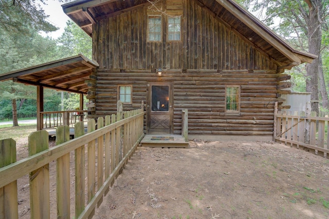 W3562 Glencoe Ave, Montello, WI 53949 - rear view of house featuring log exterior and board and batten siding