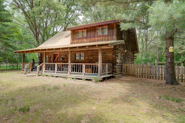 W3562 Glencoe Ave, Montello, WI 53949 - log cabin featuring log siding, a metal roof, and board and batten siding